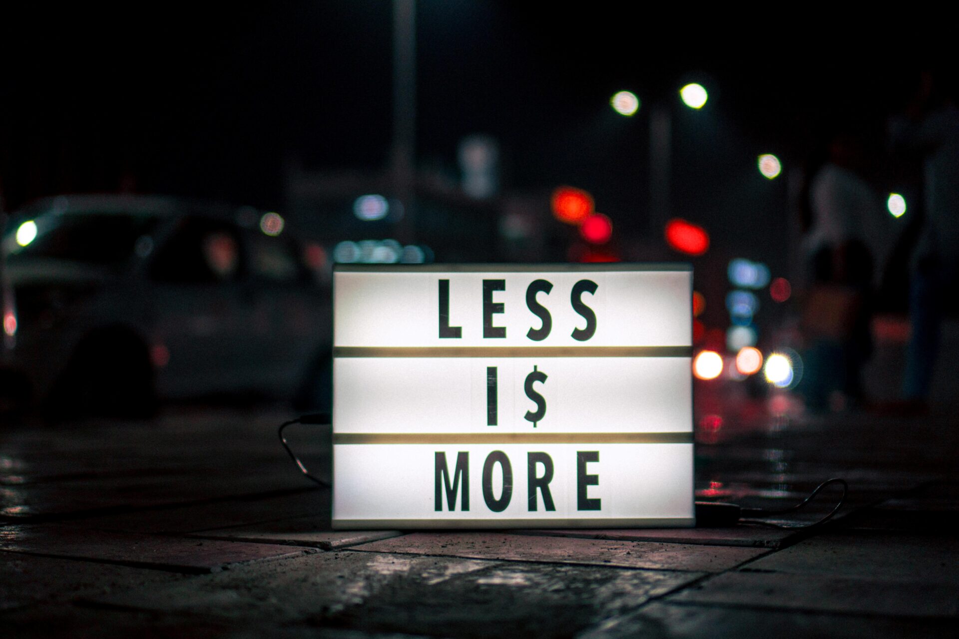 Picture of a sign saying Less is More, denoting moderate income is enough for FIRE.