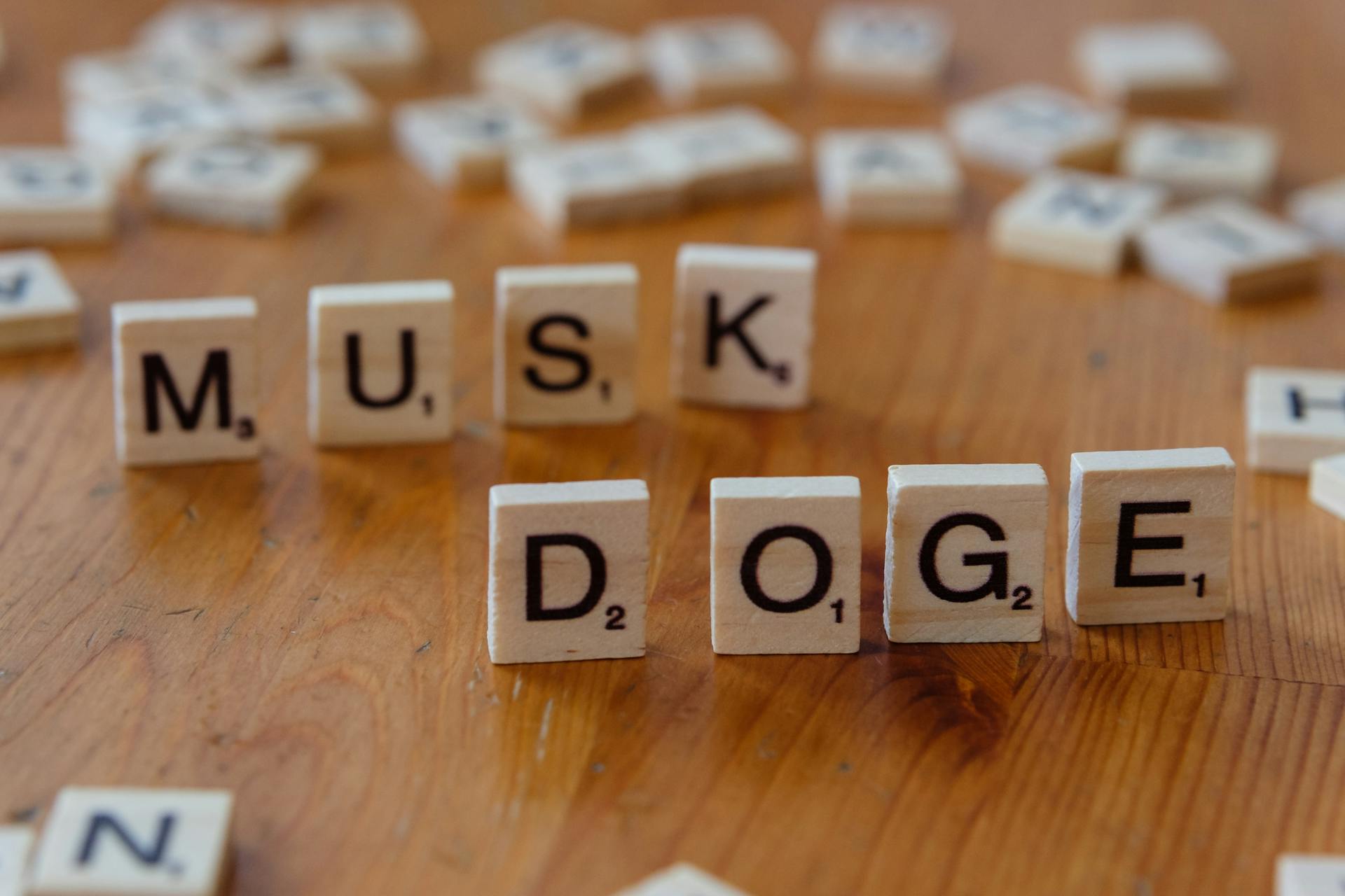 A picture of scrabble words DOGE and MUSK.